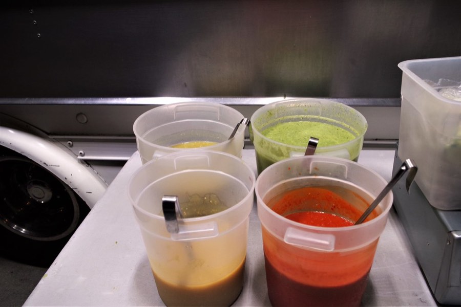 Fresh red and green salsas in a food truck